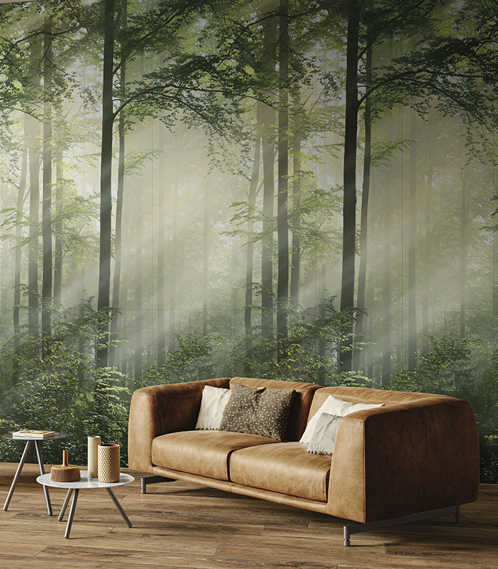 View of open-plan living room and kitchen with large glass door overlooking a small private garden. Grey stone-effect porcelain stoneware flooring.
